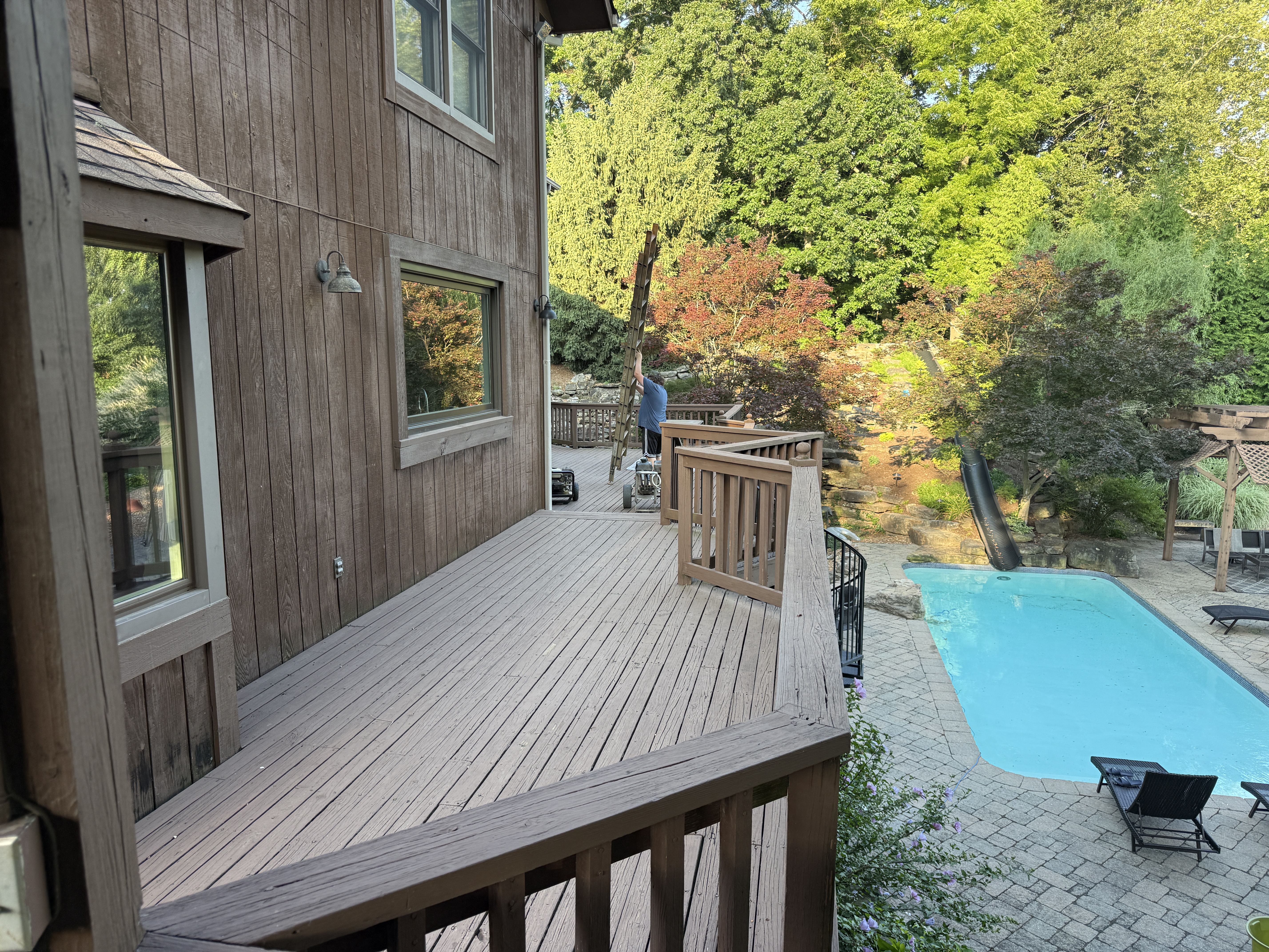 Restored deck walkway with rich brown stain