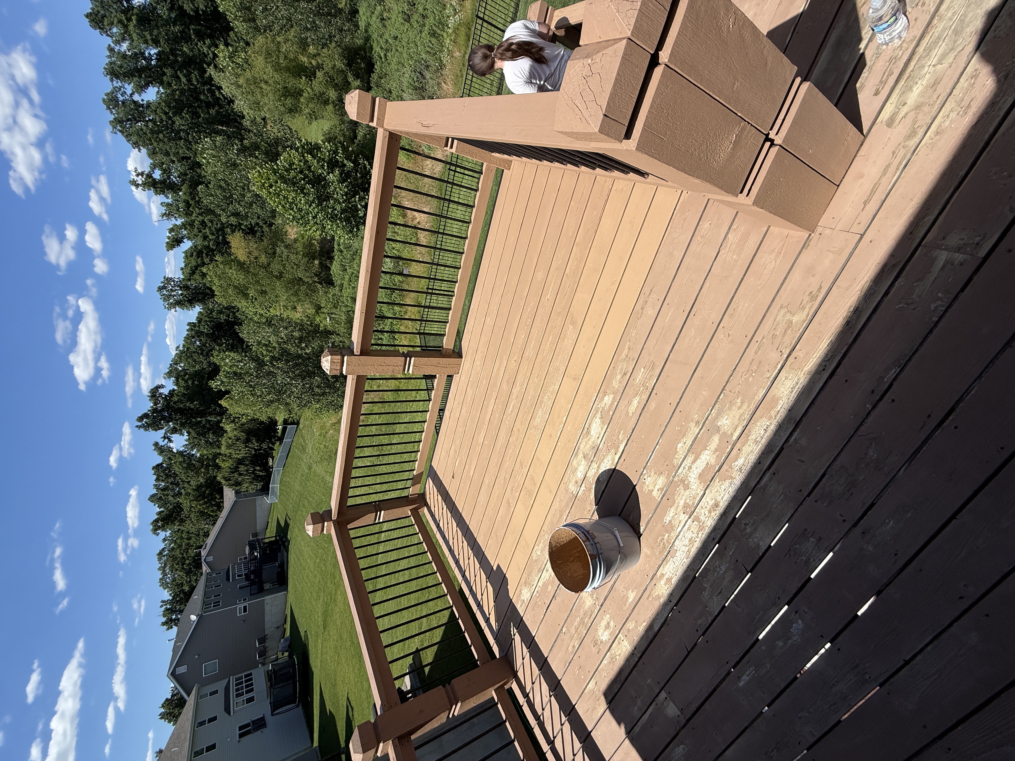 Deck mid-stain with supplies